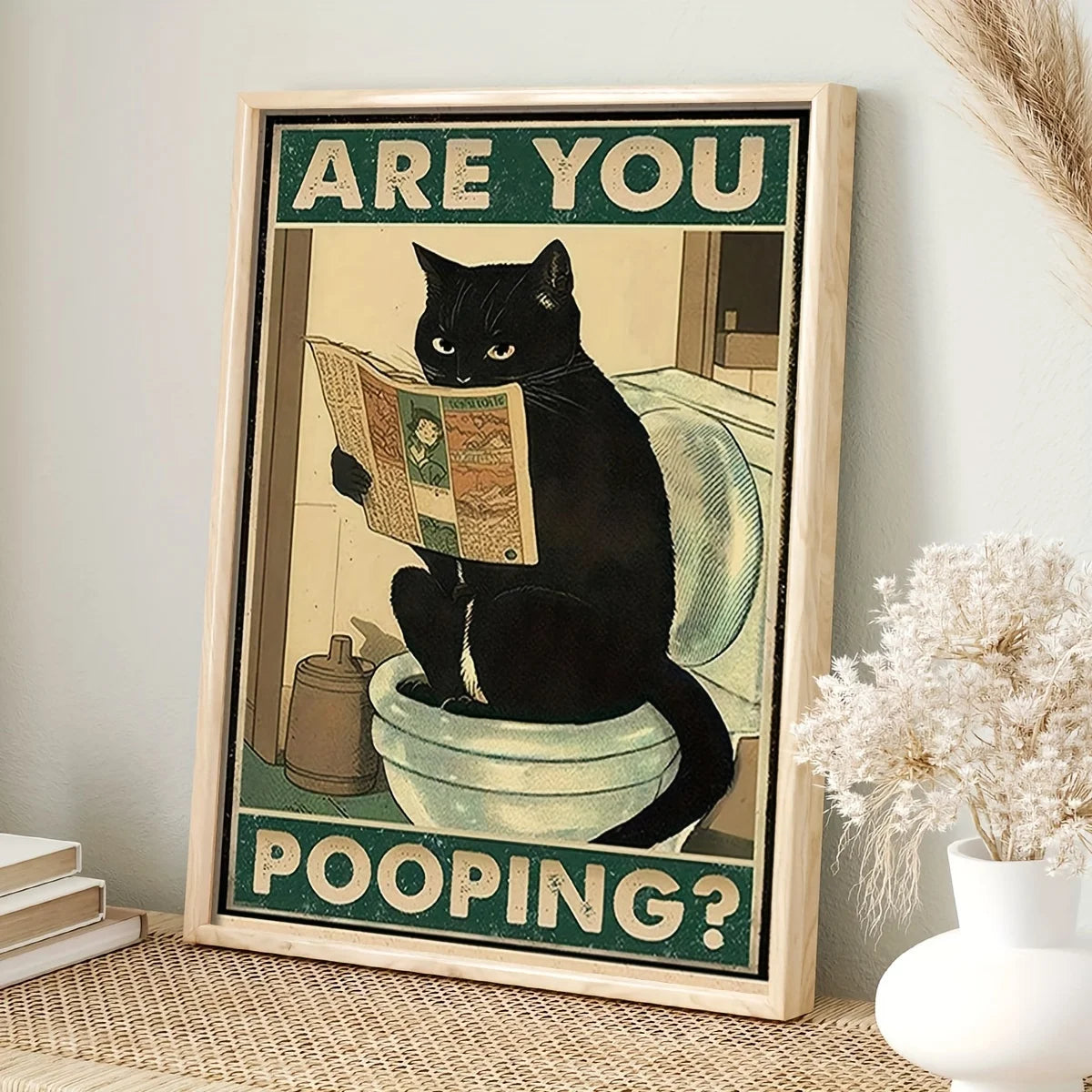 Funny black cat pooping poster with newspaper in bathroom
