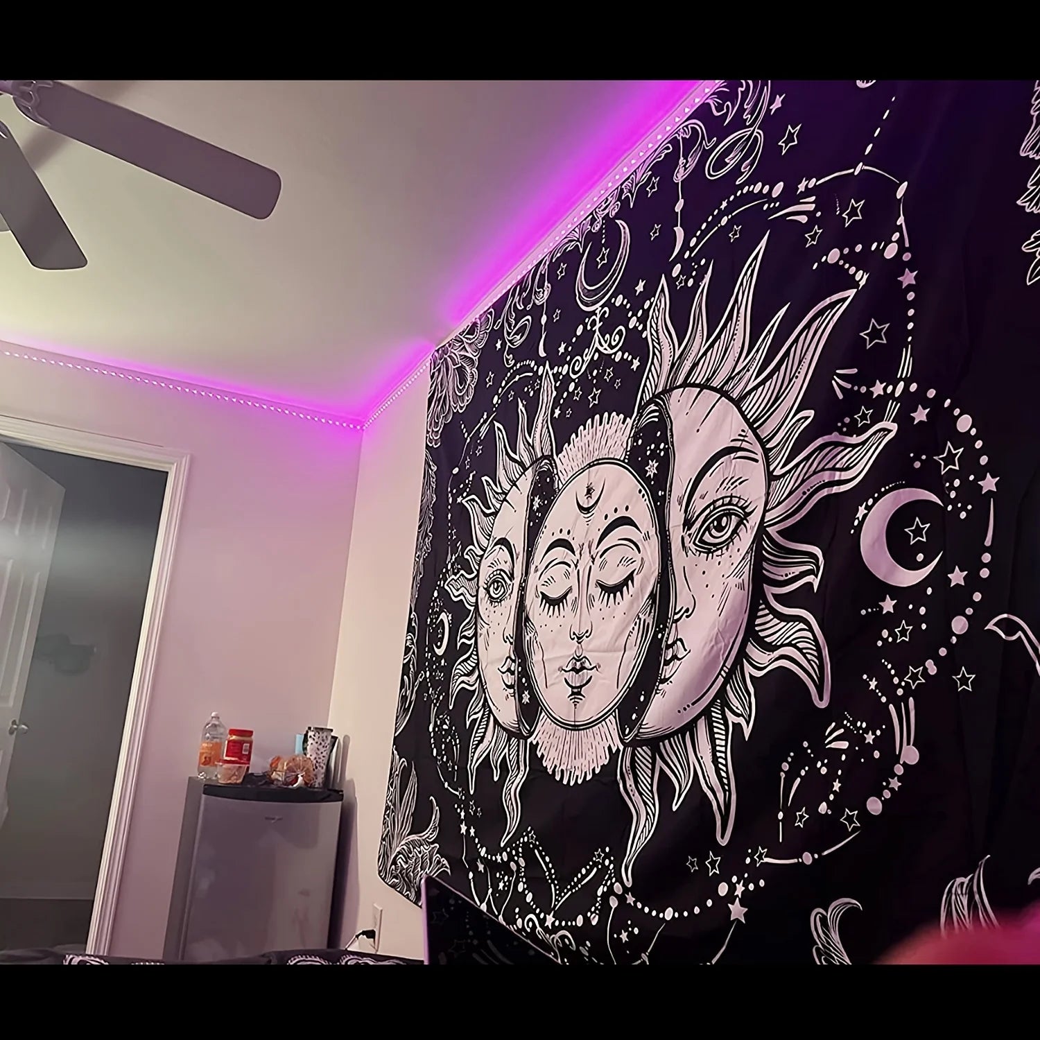 Colorful mandala wall hanging with surreal flower and eye artwork