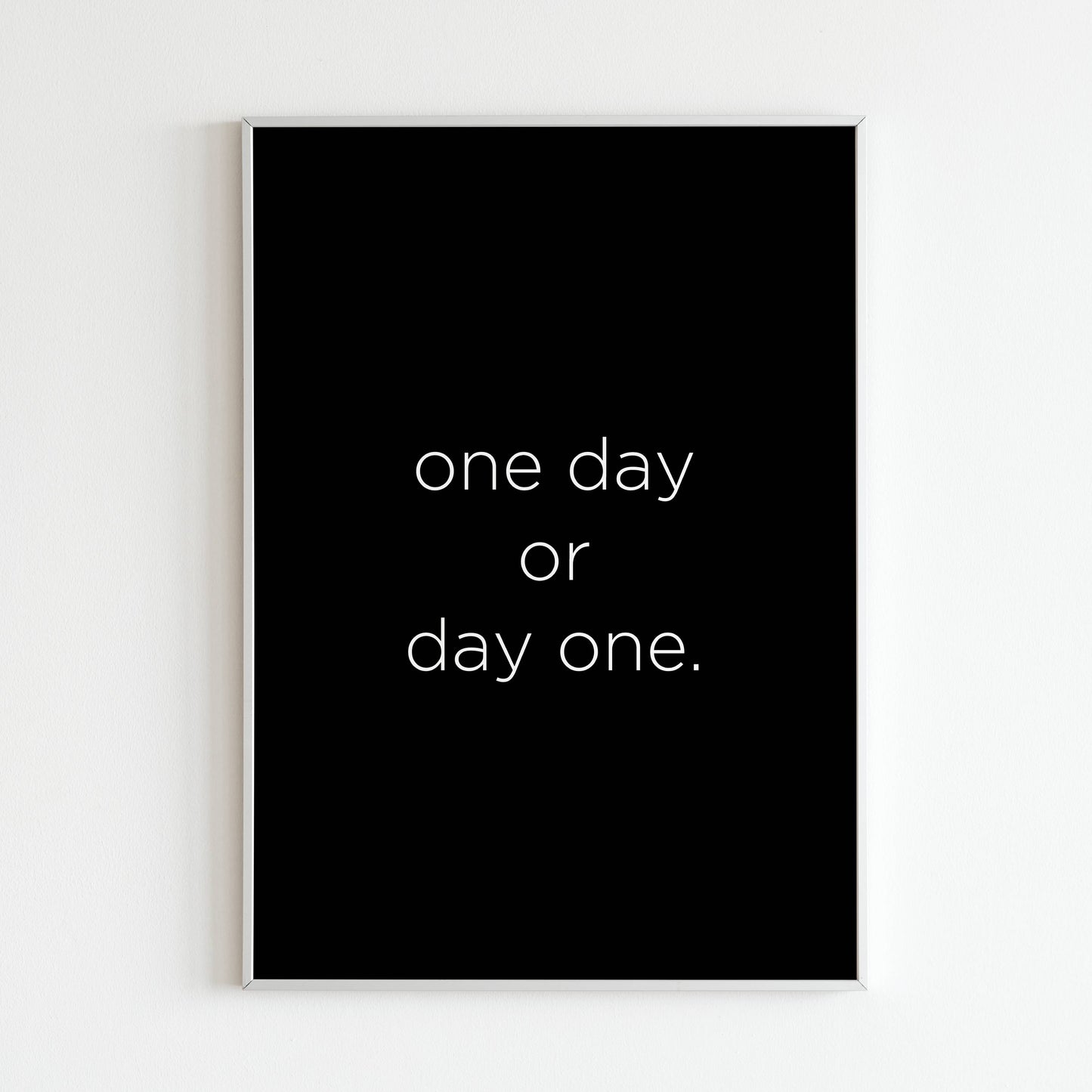 One day or day one close-up of printable wall art poster. Focus on the bold lettering and inspiring message.