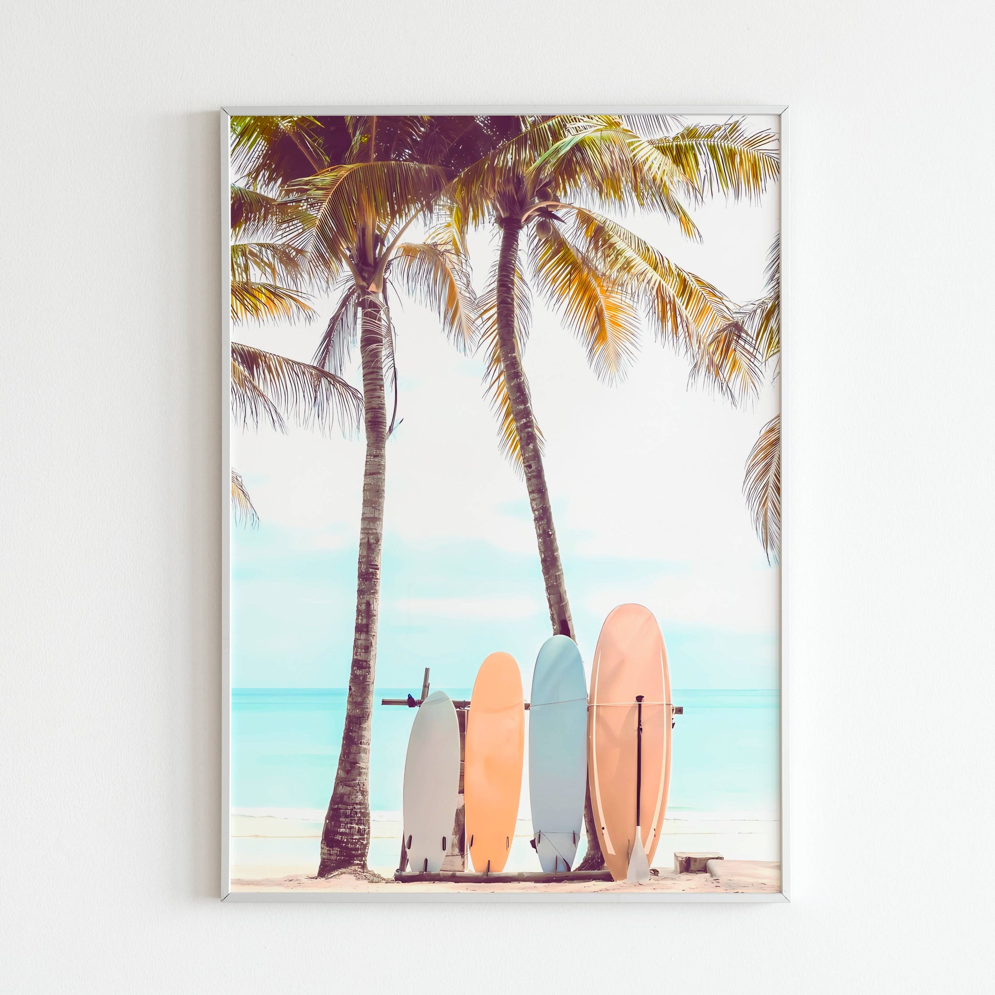 Capture the spirit of surfing with surfboards resting on a beach in this printable poster (physical or digital).